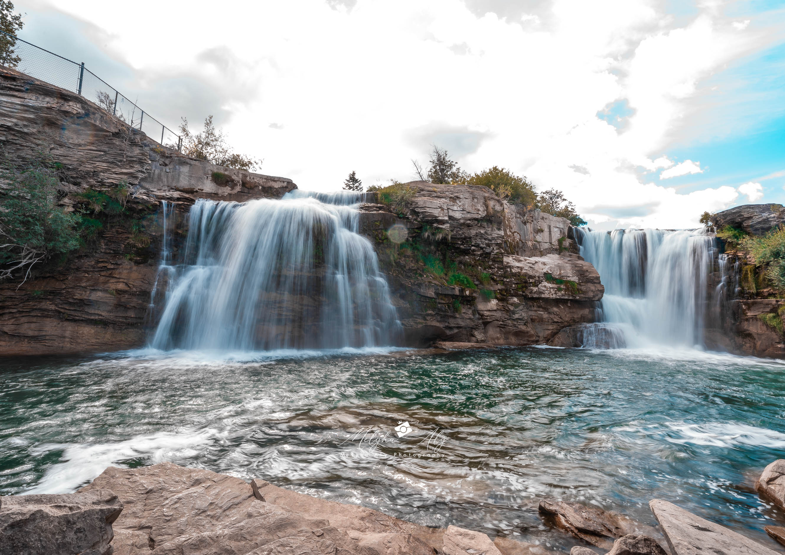 Long exposure photograph capturing the flowing water at Lundbreck Falls with silky effect
